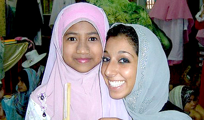 Lynn ElHarake, Fulbright English Teaching Assistants (ETA) to Malaysia, February 2011, with a student at The Muslim Girls' Fashion Club charity show in Terengganu.